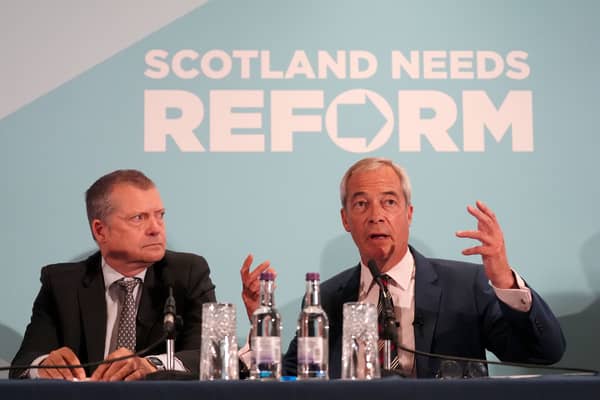 Reform UK leader Nigel Farage, right, and MSP Graham Simpson at a press conference  to announce Mr Simpson's defection to Reform on Wednesday