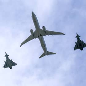 Two Tornados flank a Poseidon aircraft over the skies of RAF Lossiemouth.