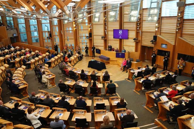 MSPs in Holyrood’s debating chamber.