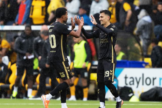 Hearts' Alexandros Kyziridis, right, and Ageu celebrate the win over Livingston.