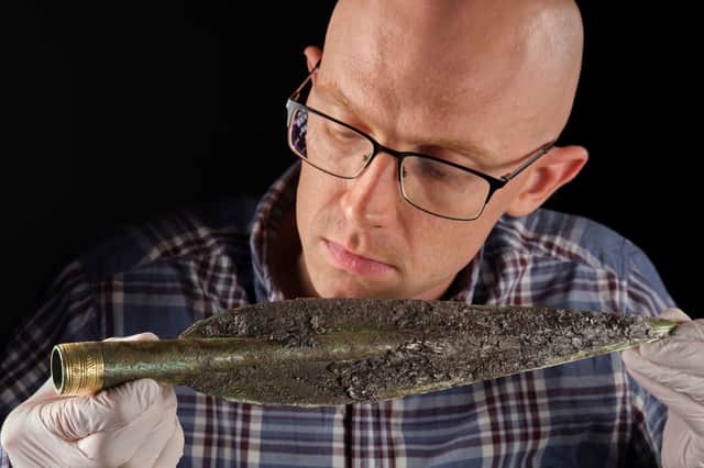Dr Matthew Knight, of National Museums Scotland, examining the Carnoustie Hoard