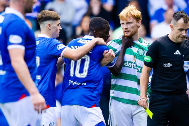 Celtic's Liam Scales (R) and Rangers' Mohamed Diomande are involved in an altercation during the goalless draw at Ibrox. (Photo by Craig Foy / SNS Group)