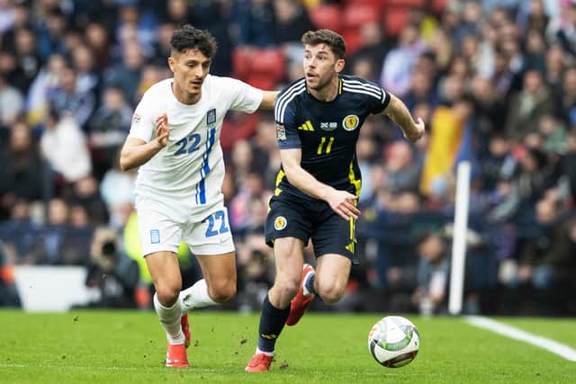 Scotland's Ryan Christie and Greece's Dimitris Giannoulis in action during a UEFA Nations League 2024/25 League A/B Play-Off Second Leg match at Hampden Park, on March 23, 2025. (Photo by Alan Harvey / SNS Group)