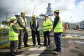 Prime Minister Keir Starmer speaks to apprentices, backdropped by HMS Glasgow 