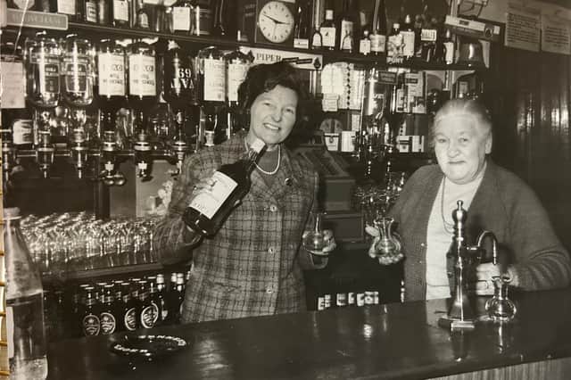Elizabeth ‘Ma’ Hunter (right) with her daughter Mary Stephen (left) behind the bar at The Ship.
