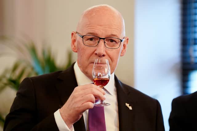 John Swinney takes part in a whisky tasting session during a visit to the Auchentoshan Distillery in May