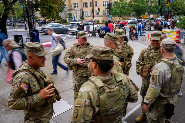 National Guard troops from South Carolina stand outside the Foggy Bottom Metro Station in Washington DC last month, after Donald Trump ordered them onto the streets of the US capital (Picture: Andrew Harnik)