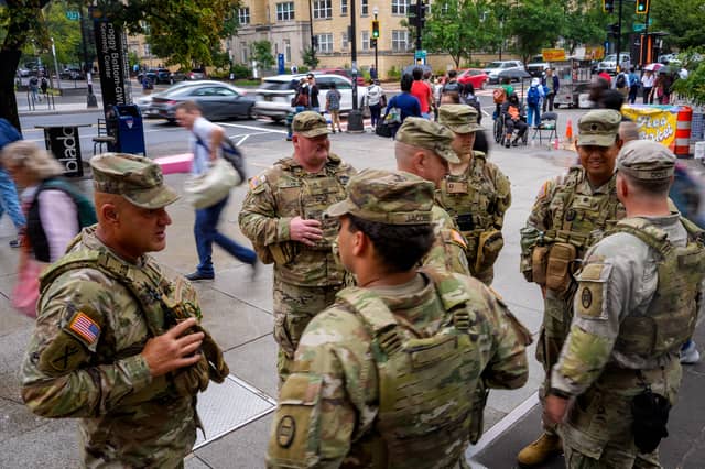 National Guard troops from South Carolina stand outside the Foggy Bottom Metro Station in Washington DC last month, after Donald Trump ordered them onto the streets of the US capital (Picture: Andrew Harnik)
