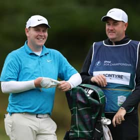 Bob MacIntyre shares a joke with his caddie Mike Burrow during the BMW PGA Championship Pro-Am at Wentworth Golf Club