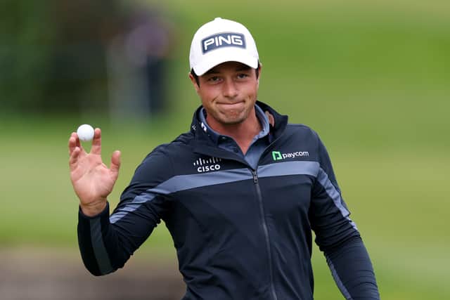 Viktor Hovland acknowledges the crowd on the 18th green following eagle on day two of the BMW PGA Championship at Wentworth Golf Club