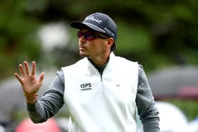 Ewen Ferguson of Scotland acknowledges the crowd on the 16th green on day four of the BMW PGA Championship at Wentworth Golf Club 
