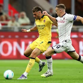 Bologna captain Lewis Ferguson challenges AC Milan's Santiago Gimenez during the Serie A match at the San Siro. (Photo by Marco Luzzani/Getty Images)