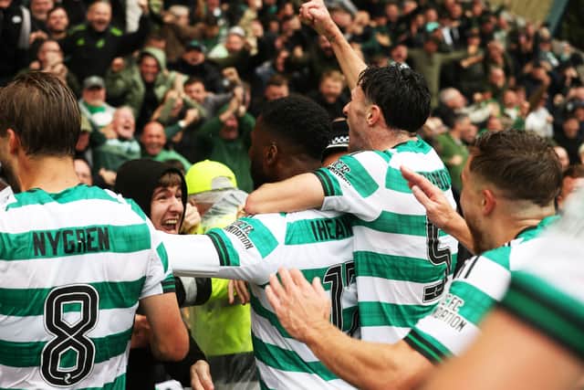 Kelechi Iheanacho and his teammates join the fans after the Nigerian converted a late penalty.