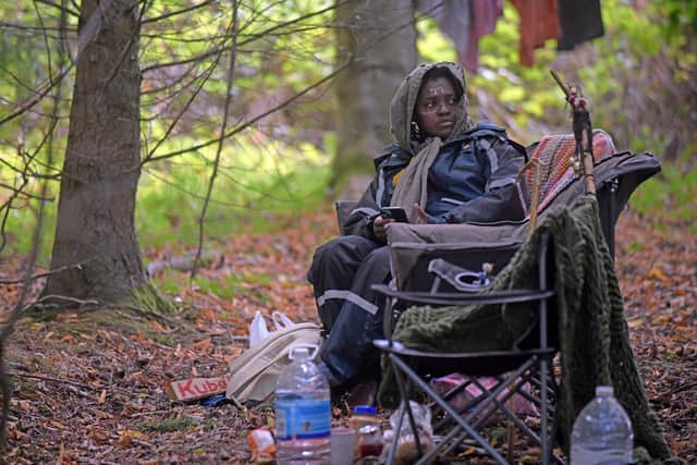 A self-styled "African tribe" has been evicted from privately-owned land in the Scottish Borders - and has moved over a small fence.