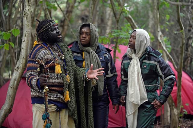 A self-styled "African tribe" has been evicted from privately-owned land in the Scottish Borders - and has moved over a small fence.