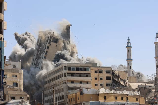 A building in Gaza City collapses after being hit by Israeli airstrikes ahead of a ground assault (Picture: Omar Al-Qattaa)
