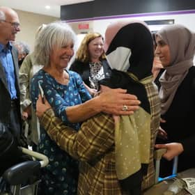 Lorna Norgrove, mother of the late aid worker Linda Norgrove, greets a group of 19 women from Afghanistan at Edinburgh Airport. They came to Scotland to complete their medical degrees after women were banned from education by the Taliban (Picture: Andrew Milligan)