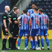 Kilmarnock player surround referee John Beaton at full-time following the controversial decision to award Celtic a late penalty. (Photo by Craig Foy / SNS Group)