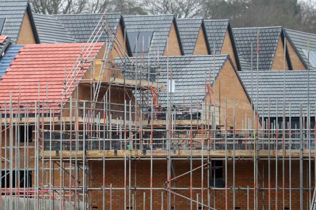 Homes under construction on a housing development.