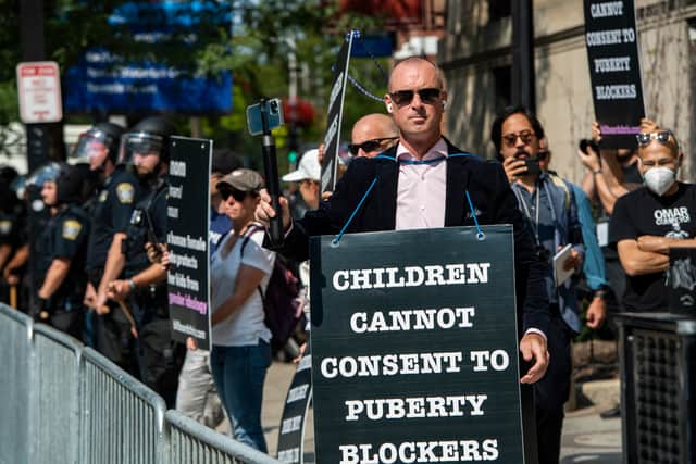 Anti-trans activist Chris Elston, joined by his supporters, demonstrates in Boston, Massachusetts.