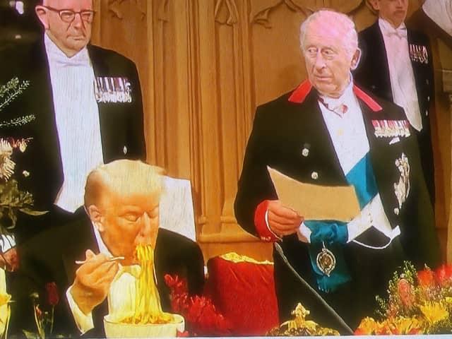 The fake image of Donald Trump eating spaghetti at the state dinner.