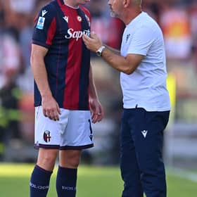 Bologna captain Lewis Ferguson in discussion with head coach Vincenzo Italiano during the Serie A match against Genoa at Renato Dall'Ara Stadium on Saturday. (Photo by Alessandro Sabattini/Getty Images)