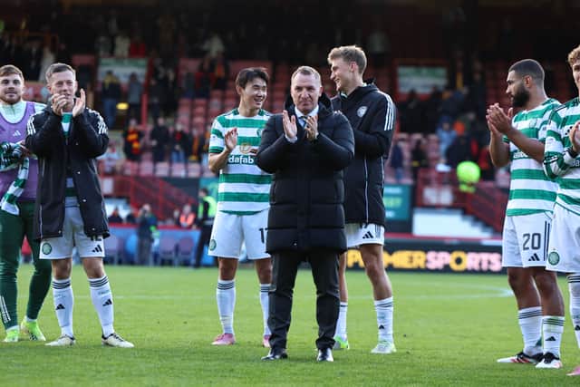 Celtic manager Brendan Rodgers applauds the supporters at full-time after the 4-0 win over Partick Thistle at Firhill. (Photo by Ross MacDonald / SNS Group)