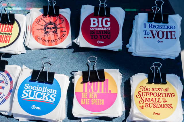 Stickers with slogans are given away during a speech by Turning Point USA founder Charlie Kirk at the University of Nevada during his ‘You're Being Brainwashed’ tour in October 2024