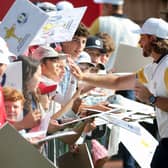 Team Europe member Tommy Fleetwood signs autographs for fans during a practice round for the 45th Ryder Cup at Bethpage Black