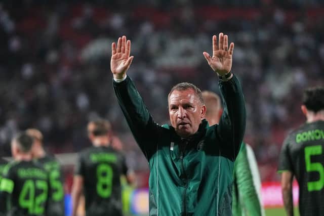 Celtic's head coach Brendan Rodgers greets supporters after the Europa League draw with Red Star Belgrade. (AP Photo/Darko Vojinovic)