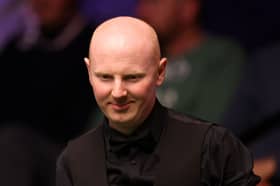 Scotland's Anthony McGill is through to the third round of the British Open snooker.