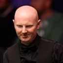 Scotland's Anthony McGill is through to the third round of the British Open snooker.