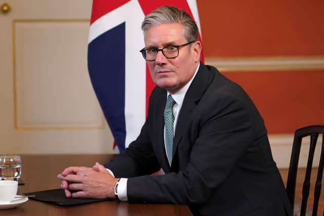 Keir Starmer hopes his ID card scheme will make him look tough on illegal immigration (Picture: Alberto Pezzali/WPA pool)