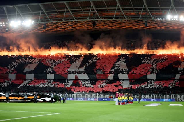 Nice supporters light flares ahead of their Europa League match against Roma at the Allianz Riviera Stadium.