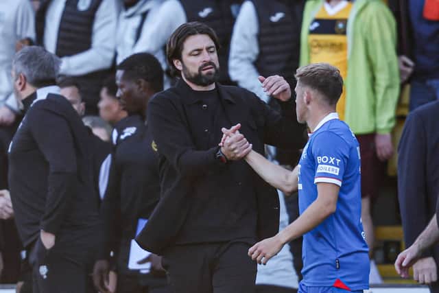 Russell Martin celebrates Rangers' win with midfielder Connor Barron.