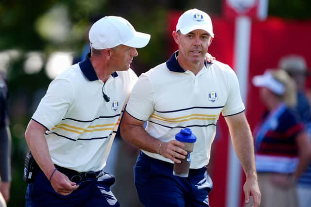 Team Europe Captain Luke Donald with Rory McIlroy during the Sunday singles matches on day three.