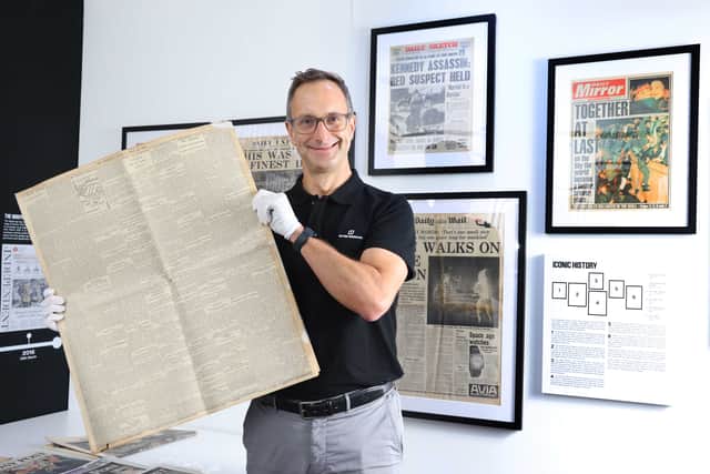 Robert May, managing director of Historic Newspapers, with a copy of a rare 1909 edition of The Scotsman, reporting the first flight across the English Channel.