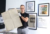 Robert May, managing director of Historic Newspapers, with a copy of a rare 1909 edition of "The Scotsman", reporting the first flight across the English Channel .