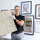 Robert May, managing director of Historic Newspapers, with a copy of a rare 1909 edition of "The Scotsman", reporting the first flight across the English Channel .