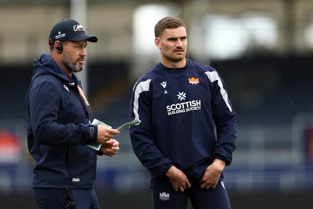 Attack and backs coach Scott Mathie (L) and centre James Lang during an Edinburgh Rugby training session at Hive Stadium.