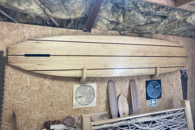 A classic wooden longboard by Frazer Reid