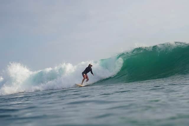 Frazer Reid riding one of his wooden surfboards in Sri Lanka