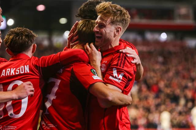 Stuart Armstrong celebrates Aberdeen's opening goal with penalty marksman Jesper Karlsson.