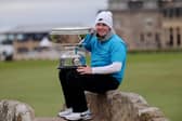 Bob MacIntyre shows off the impressive Alfred Dunhill Links Championship trophy on the Swilcan Bridge