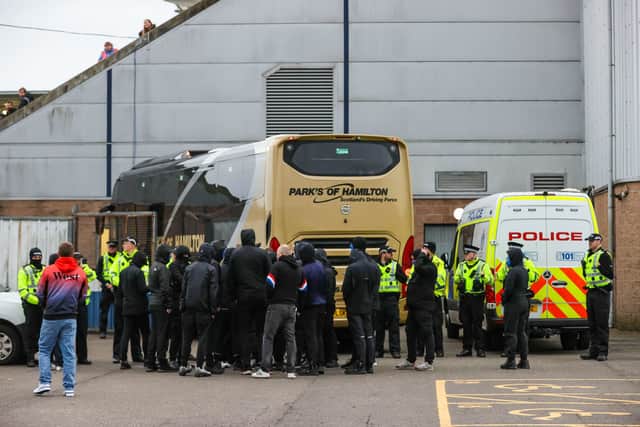 Rangers fans clash with police as they look to stop the Rangers team bus leaving after a William Hill Premiership match between Falkirk and Rangers at the Falkirk Stadium.