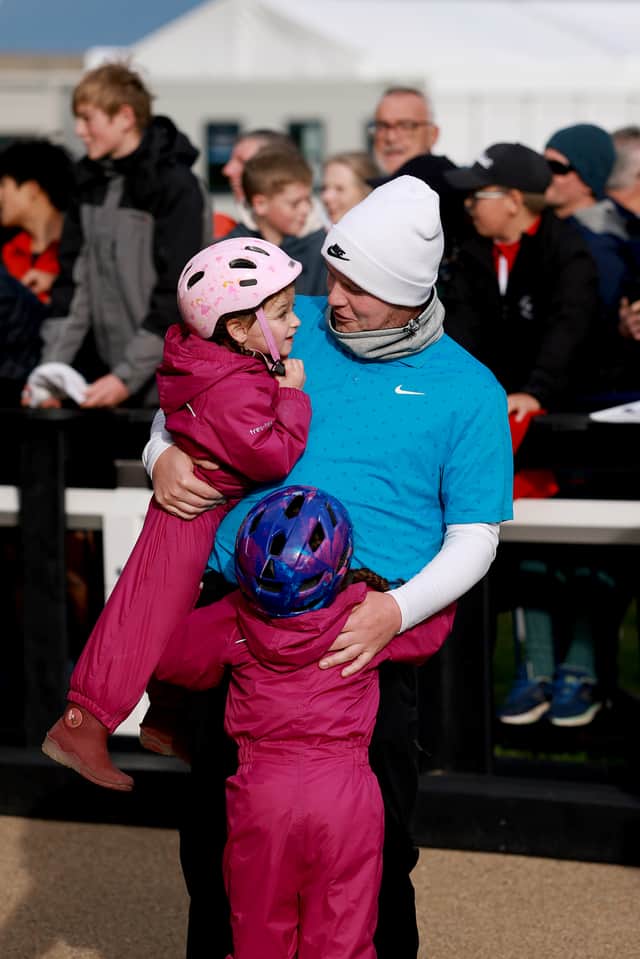 Bob MacIntyre celebrates his fourth DP World Tour win with his nieces, Lottie and Penny, at St Andrews 