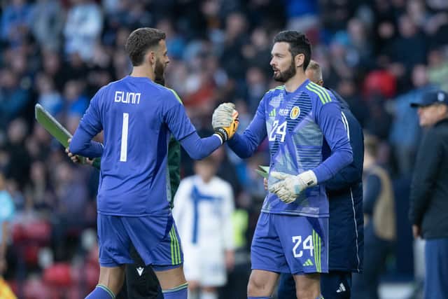 Scotland's Angus Gunn shakes hands with Craig Gordon