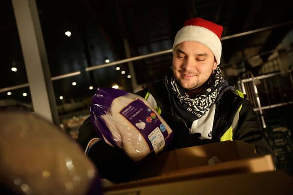 A staff member packs fresh turkeys ready for delivery at Sainsbury's Waltham Point Distribution Centre. Around 19,000 seasonal jobs are being created across one of the UK’s biggest retailers for Christmas (Photo: Matthew Lloyd/Getty Images)