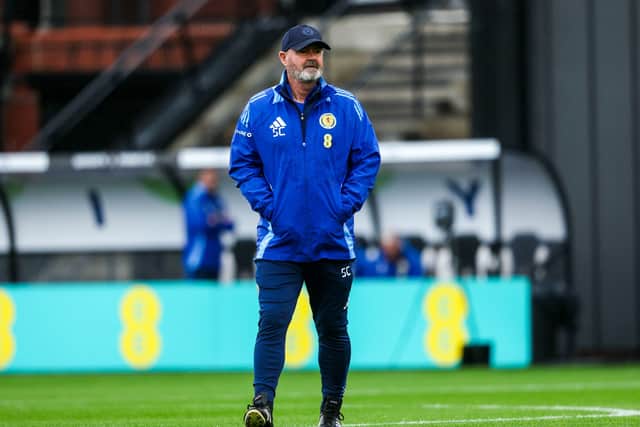 Scotland head coach Steve Clarke observes training ahead of facing Greece.