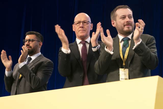 First Minister John Swinney applauds SNP Westminster leader Stephen Flynn's conference speech.